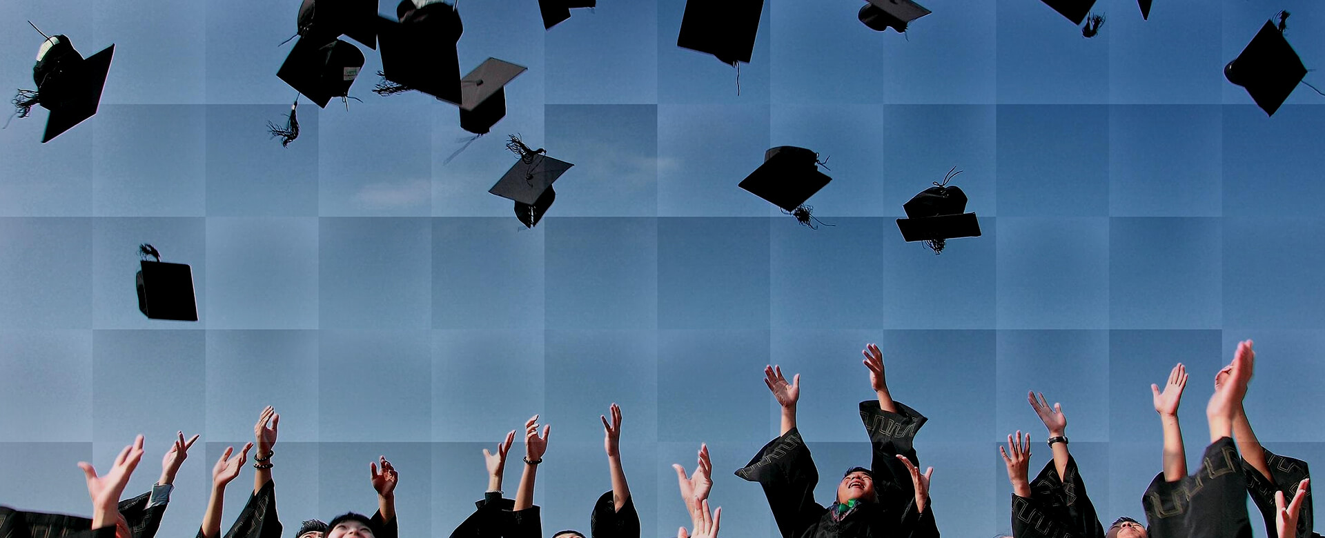 Background of college graduates throwing their caps into the air