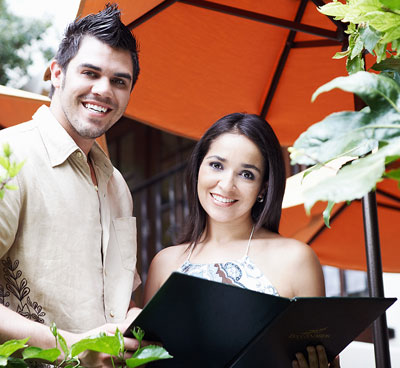 A couple on their laptop smiling