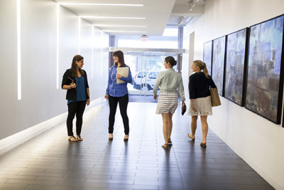 Employees walking together in a hallway