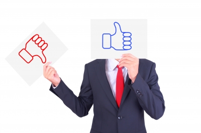 5 Perks Job Seekers Should Weigh_Beyond Money represented by thumbs up and thumbs down