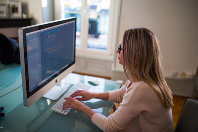 A lady working on her computer