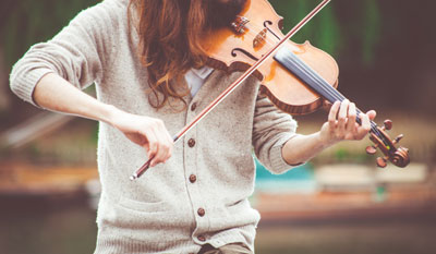 A woman playing an instrument