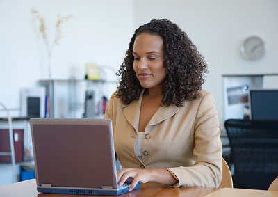 A woman working on a laptop