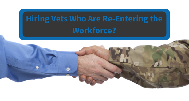 A hand of a civilian hiring manager shaking the hand of a veteran