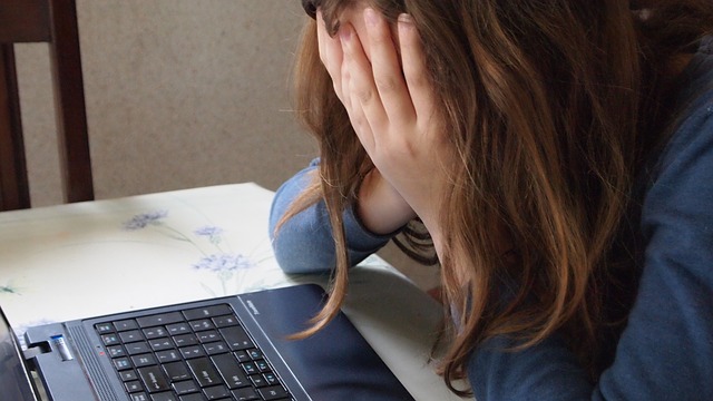 A frustrated seeker at her desk