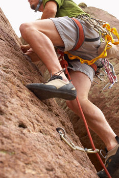 person climbing and pushing their career ahead