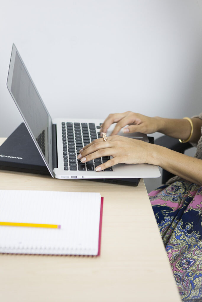 A woman tech employee on her laptop