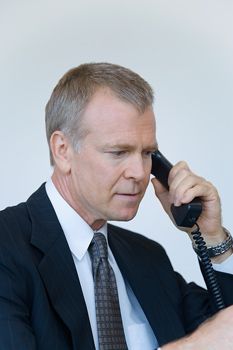 Phone Interview Secrets to Success with picture of job seeker on phone interview