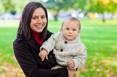 A woman holding her baby