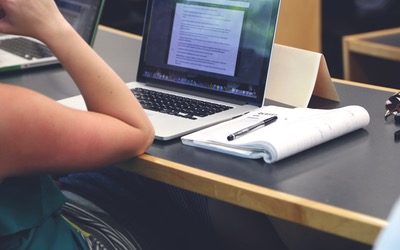 a laptop and notepad